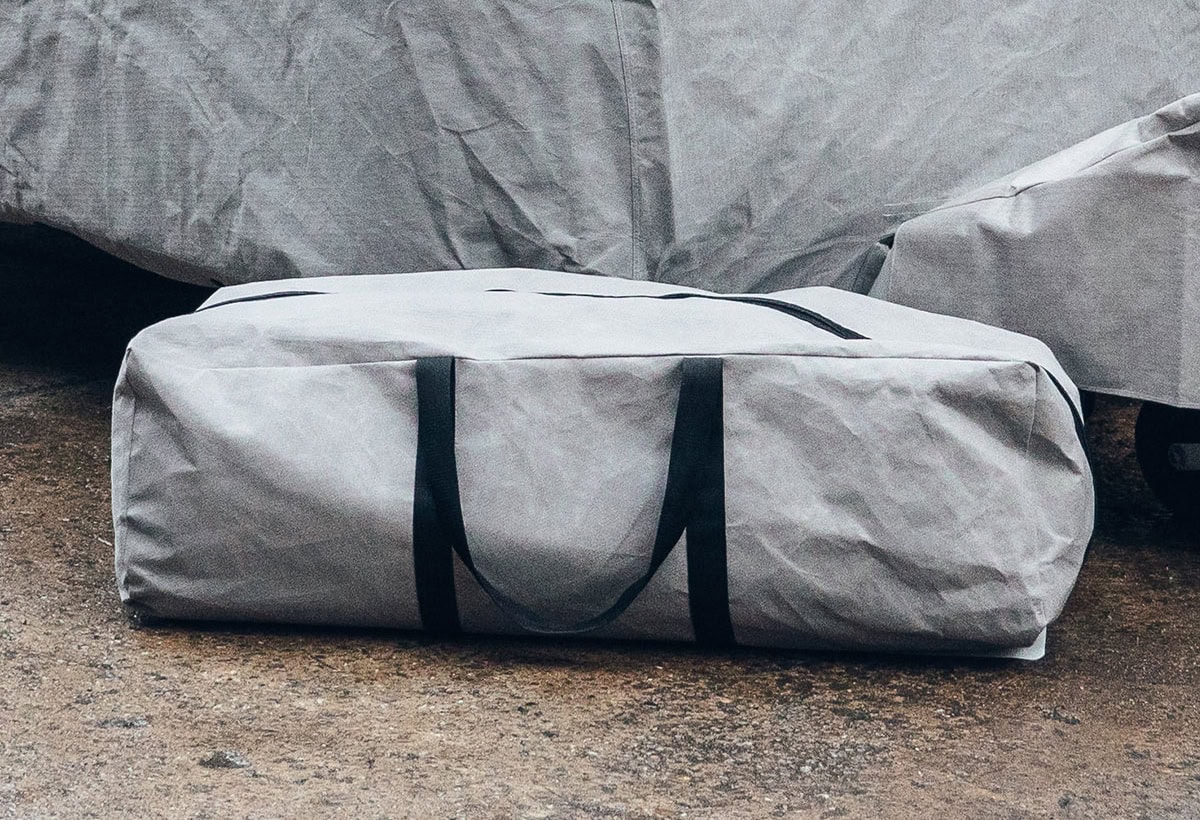 A picture of a grey Caravan Upgraded Storage bag with black zips and handles.