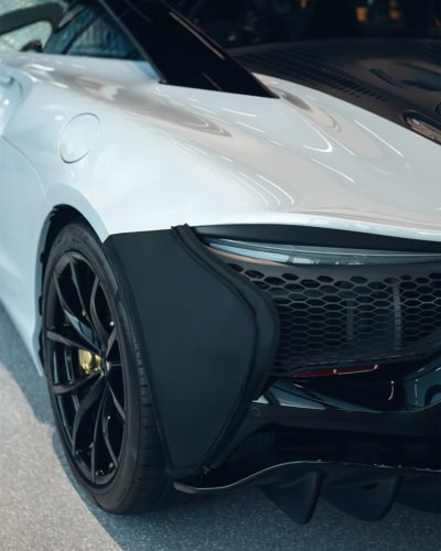 A close up of stone chip body protection covers on a Mclaren