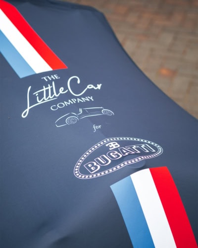 A close up of the custom printing on a printed car cover.