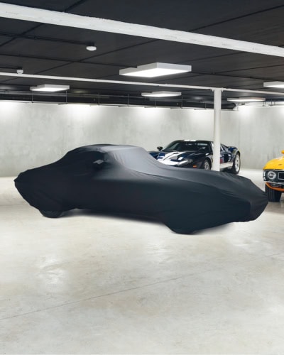 A picture showing a snug fitting Indoor Elite car cover on a Jaguar E-Type.