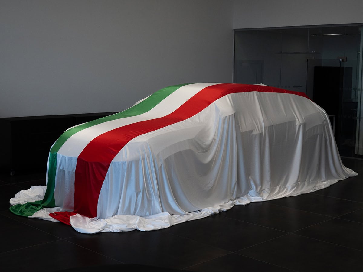 A picture of a Lamborghini with an Italian flag printed Indoor Reveal.