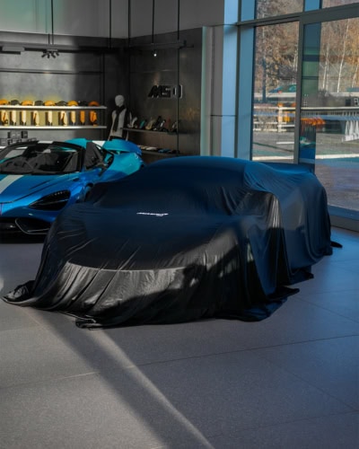 An image of a Mclaren with a black Indoor Reveal cover.