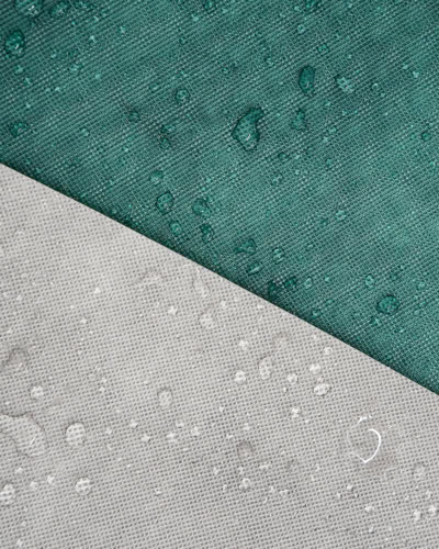 A close up image of the Specialised Covers Torrent material with water beads.