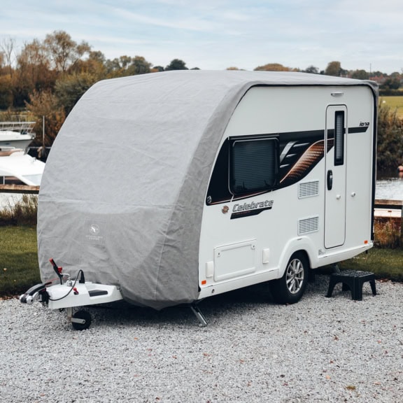 A caravan on a storage site with a bespoke fit Roof Cover.