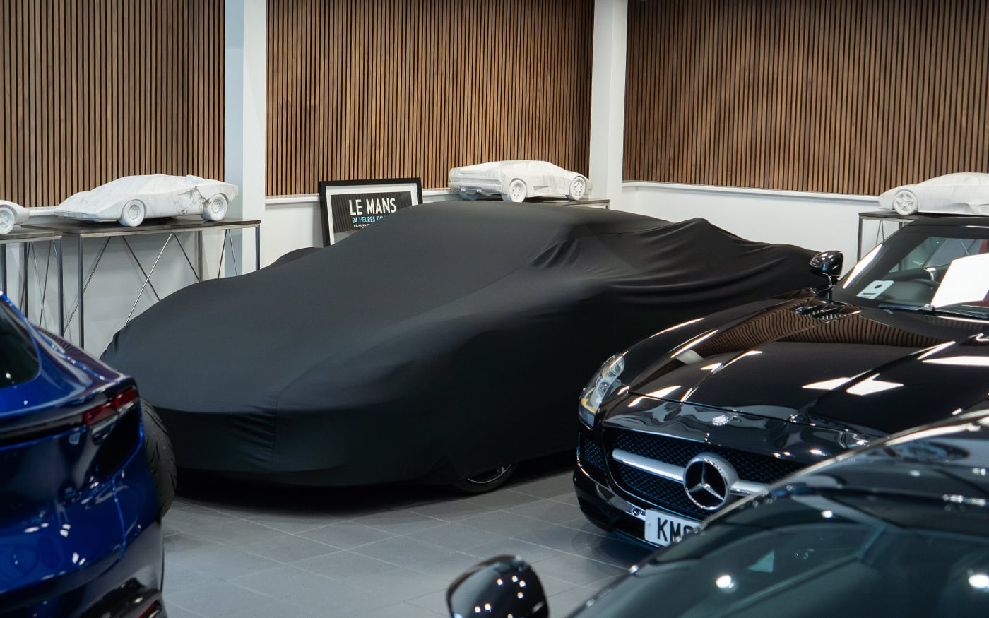 A universal fitting car cover on a Ferrari.