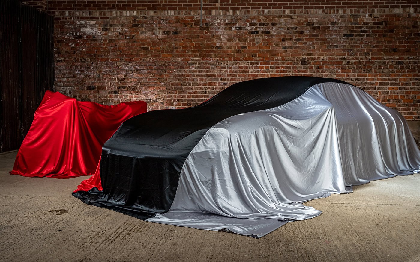 A motorbike and car with different colour variations of Indoor Reveal covers.