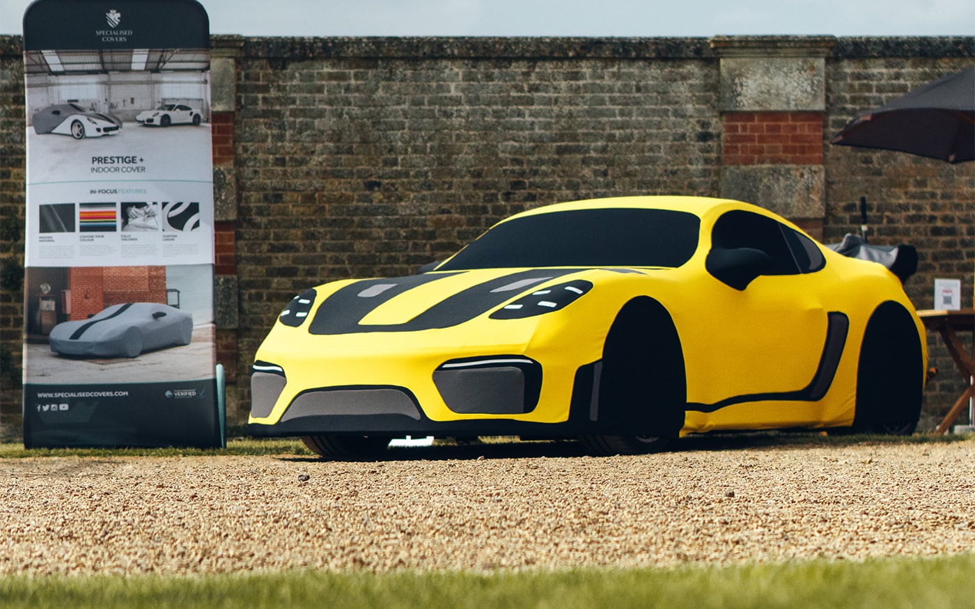 An Indoor Silhouette Car Cover on designed to look like a Porsche Cayman GT4