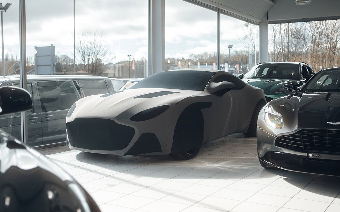 A picture of an Indoor Silhouette cover designed to look like an Aston Martin.