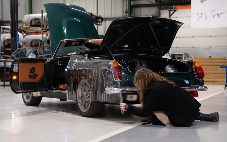 A picture of our design team working on a pattern for a car cover.