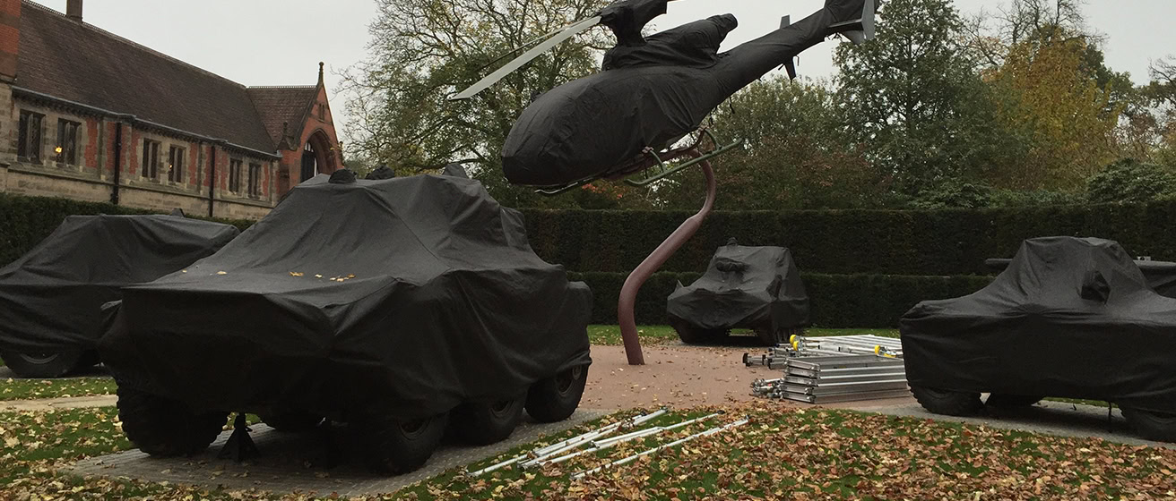 Collection of Helicopters and Tanks all with bespoke covers on them.