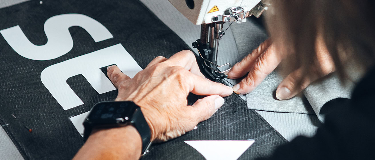 Sewing Machinist working on a satellite dome cover.